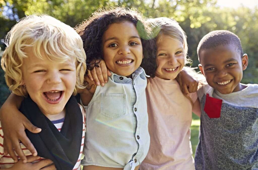 group of children smiling together
