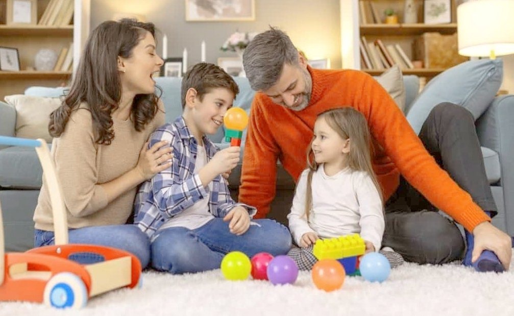 family is enjoying and children are playing with toys