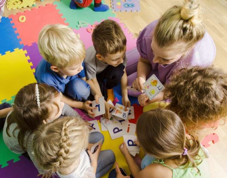 teacher is promoting early education of children