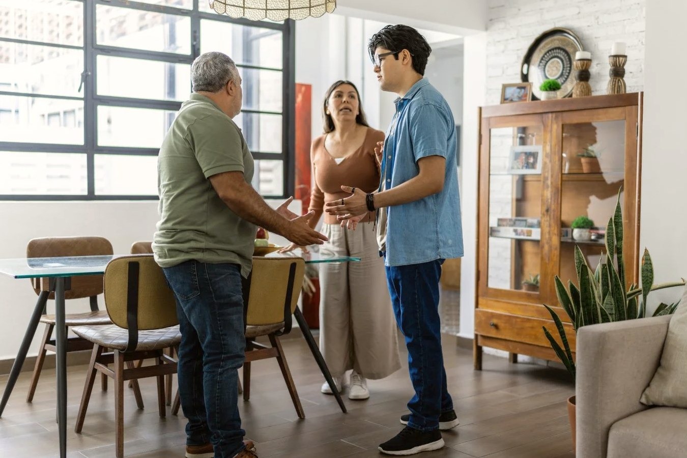 A toxic family are arguing with each other. A toxic mother and father are trying to ask something to their son