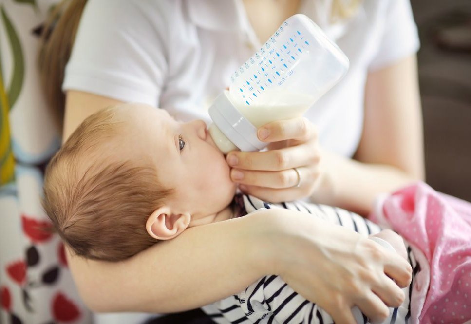 Mother is feeding the baby