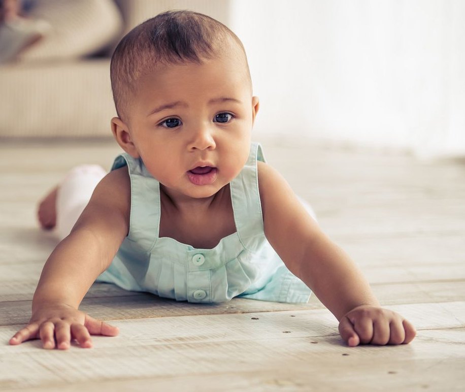 2 month old baby is trying to crawl