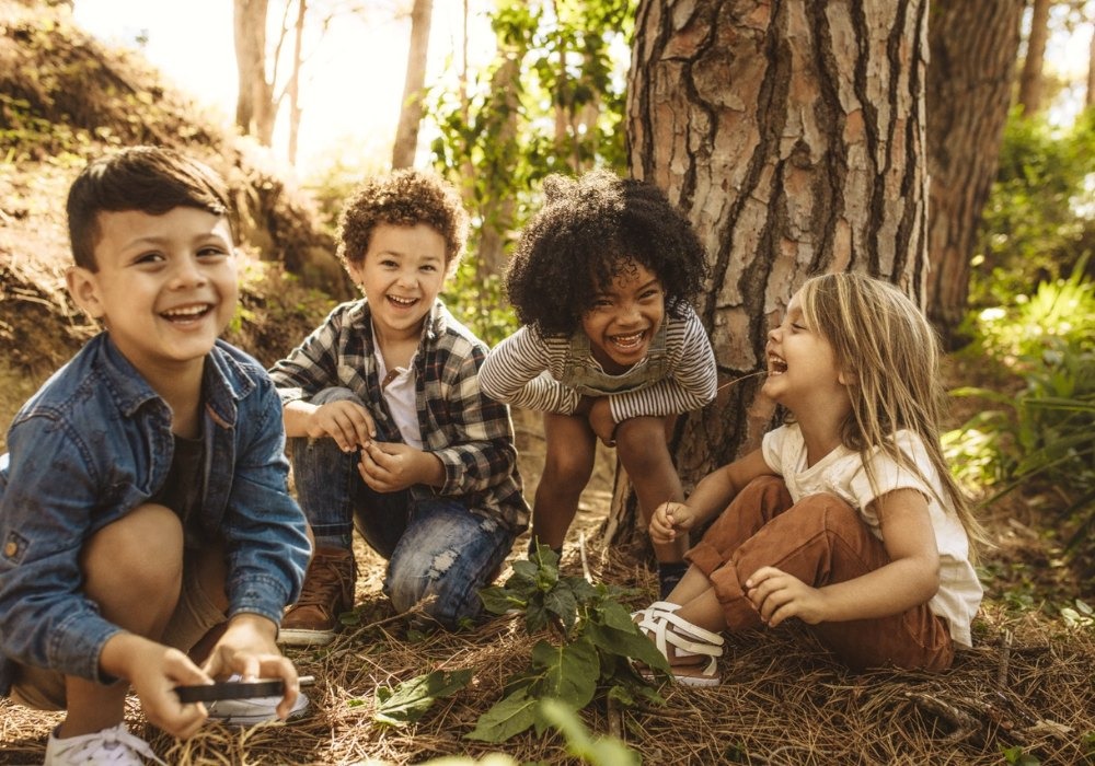 toddlers activites in forest trip. Toddlers are laughing together