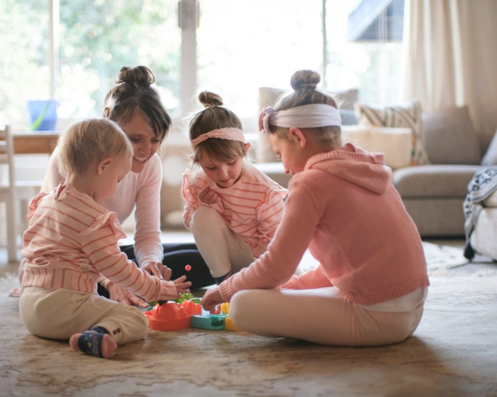 mother and children are playing at home