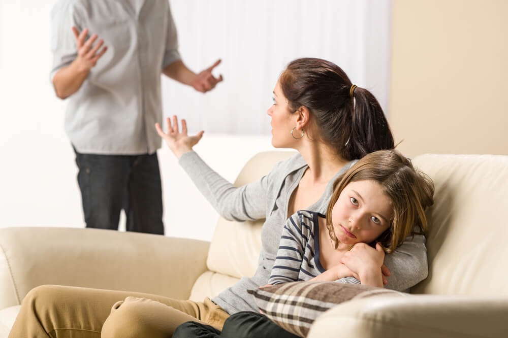 father is shouting on daughter and mother is trying to stop her husband